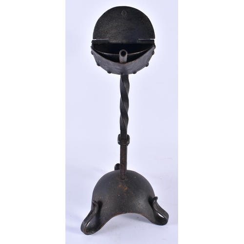 355 - A LOVELY ARTS AND CRAFTS WROUGHT IRON BETTY LAMP of organic form. 30 cm x 17 cm.