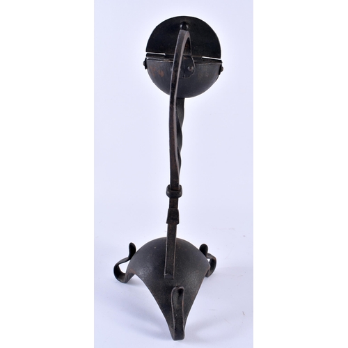 355 - A LOVELY ARTS AND CRAFTS WROUGHT IRON BETTY LAMP of organic form. 30 cm x 17 cm.