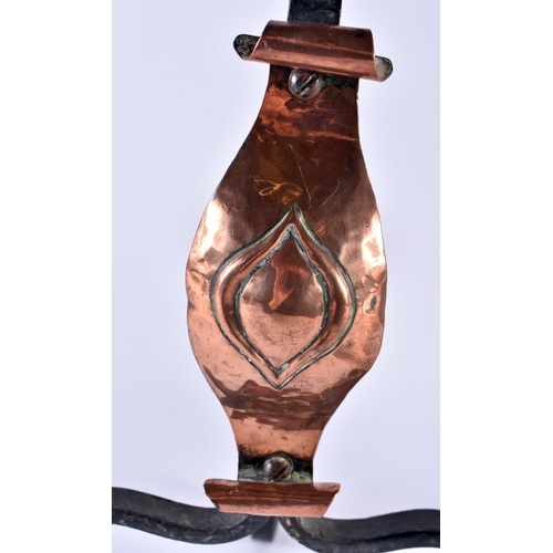 356 - A PAIR OF ARTS AND CRAFTS COPPER AND WROUGHT IRON ANDIRONS decorated with a motif. 35 cm x 14 cm.