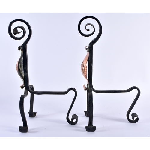 356 - A PAIR OF ARTS AND CRAFTS COPPER AND WROUGHT IRON ANDIRONS decorated with a motif. 35 cm x 14 cm.