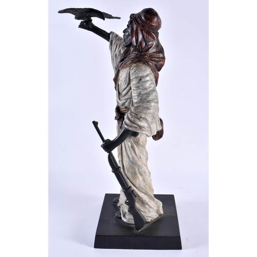 358 - A LARGE CONTINENTAL COLD PAINTED BRONZE FIGURE OF A HUNTER modelled holding aloft a hawk. 42 cm x 12... 