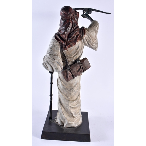 358 - A LARGE CONTINENTAL COLD PAINTED BRONZE FIGURE OF A HUNTER modelled holding aloft a hawk. 42 cm x 12... 