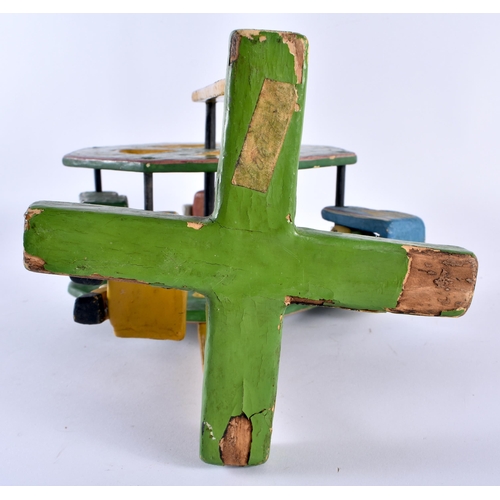 361 - A CHARMING VINTAGE SOUTH AMERICAN FOLK ART PAINTED WOOD FERRIS WHEEL. 32 cm x 15 cm.