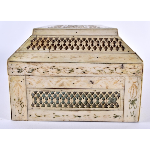 372 - A 19TH CENTURY CONTINENTAL CARVED BONE CASKET decorated all over with filigree motifs. 21 cm x 14 cm... 