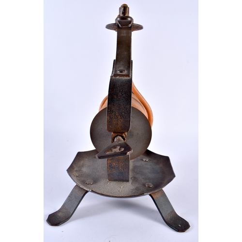 384 - A RARE LARGE ARTS AND CRAFTS WROUGHT IRON WAX JACK of stylised form. 28 cm x 20 cm.