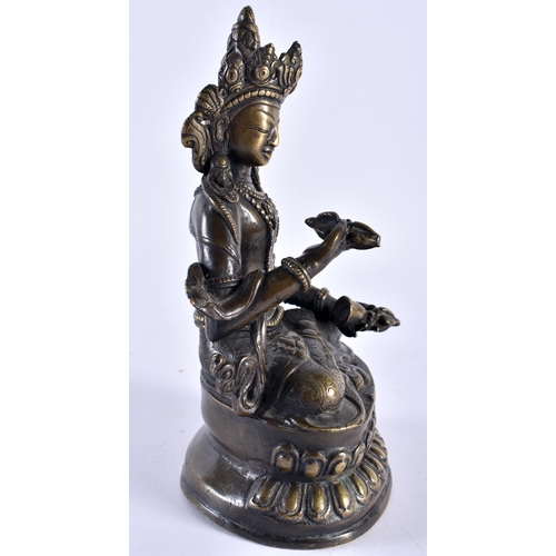 390 - A 19TH CENTURY TIBETAN NEPALESE BRONZE FIGURE OF A SEATED BUDDHA modelled holding Buddhistic items, ... 