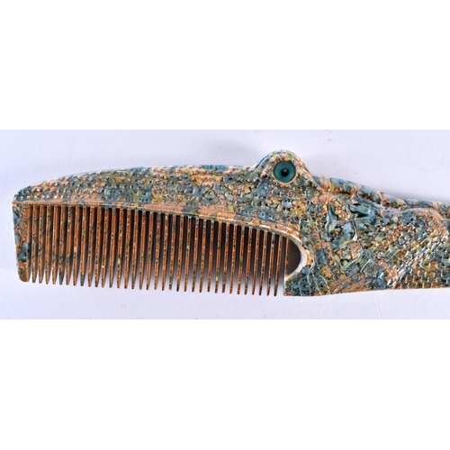 391 - A RARE 1970S FRENCH ALIGATOR COMB together with an antique agate letter opener. Largest 26 cm wide. ... 