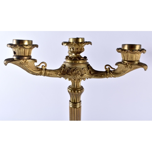 408 - A LARGE PAIR OF 19TH CENTURY EUROPEAN GILT BRONZE CANDLEABRA formed with acanthus capped columns, up... 