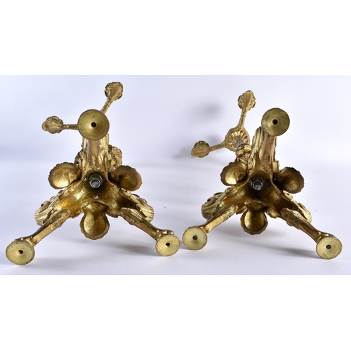 408 - A LARGE PAIR OF 19TH CENTURY EUROPEAN GILT BRONZE CANDLEABRA formed with acanthus capped columns, up... 