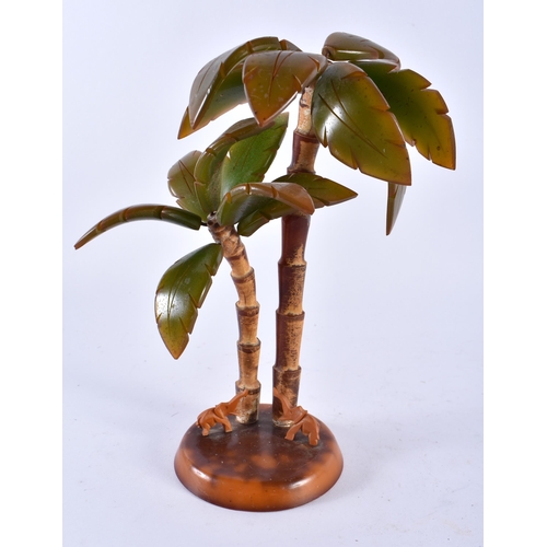 423 - AN ART DECO BAKELITE PALM TREE GROUP together with an Art Nouveau frame & a Bakelite desk stand. Lar... 