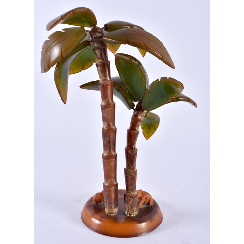 423 - AN ART DECO BAKELITE PALM TREE GROUP together with an Art Nouveau frame & a Bakelite desk stand. Lar... 