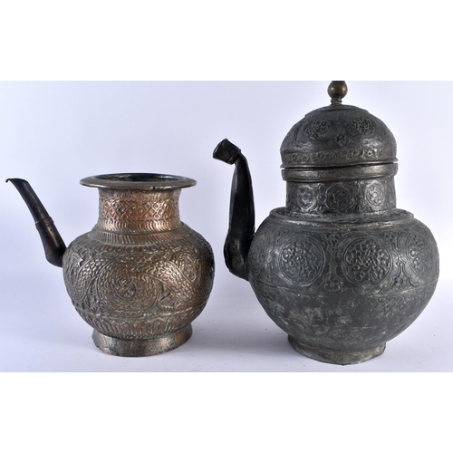 424 - AN EARLY PERSIAN MIDDLE EASTERN BRONZE EWER together with two other similar repousse ewers. Largest ... 