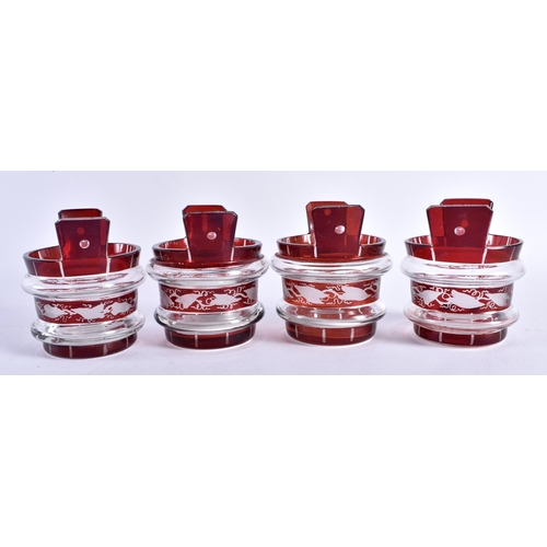 433 - AN UNUSUAL SET OF FOUR BOHEMIAN RUBY FLASH GLASS BASKET TABLE SALTS. 7.5 cm x 7 cm. (4)