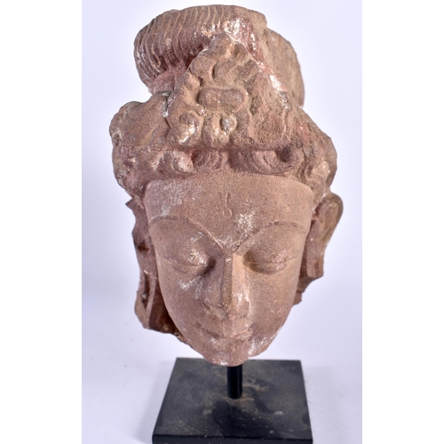 443 - AN EARLY INDIAN CARVED BUFF SANDSTONE RELIEF OF SHIVA together with an Early Indian carved pink sand... 