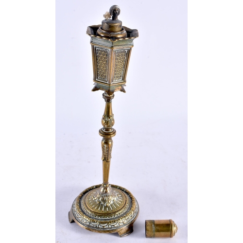 446 - A RARE ANTIQUE NOVELTY BRONZE TABLE LIGHTER formed as a Victorian lamp post. 23 cm high.