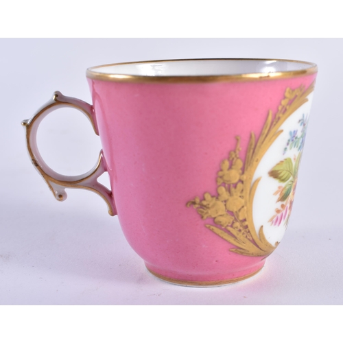 45 - A LATE 19TH CENTURY FRENCH SEVRES PORCELAIN CUP AND SAUCER painted with floral panels of a pink grou... 