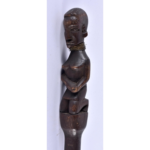 456 - AN AFRICAN TRIBAL CARVED WOOD WALKING CANE formed with a nude female. 96 cm long.