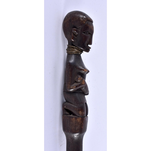 456 - AN AFRICAN TRIBAL CARVED WOOD WALKING CANE formed with a nude female. 96 cm long.