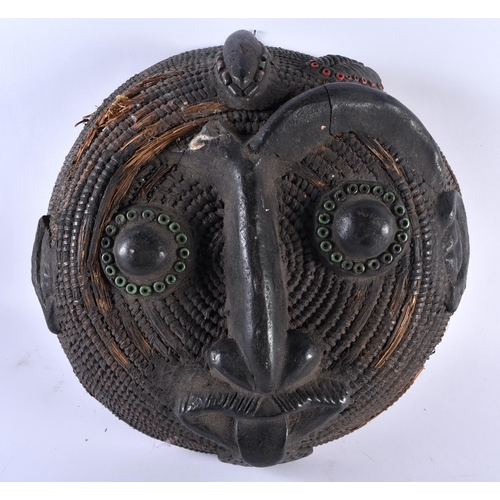 459 - AN UNUSUAL AFRICAN TRIBAL BASKET WEAVE CARVED WOOD CIRCULAR MASK together with another African mask ... 