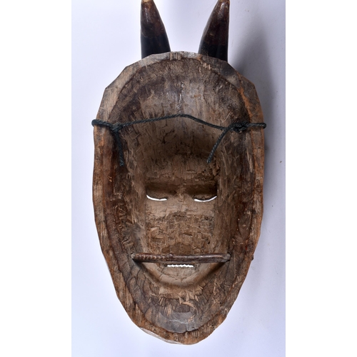 461 - TWO AFRICAN IVORY COAST TRIBAL RED PAINTED GURO WOOD MASKS. Largest 44 cm x 15 cm. (2)