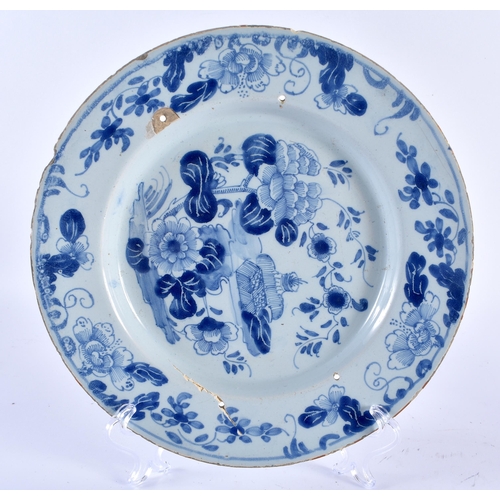 463 - AN UNUSUAL PAIR OF 18TH CENTURY DELFT TIN GLAZED POTTERY BOTANICAL PLATES together with two others. ... 