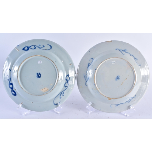 463 - AN UNUSUAL PAIR OF 18TH CENTURY DELFT TIN GLAZED POTTERY BOTANICAL PLATES together with two others. ... 