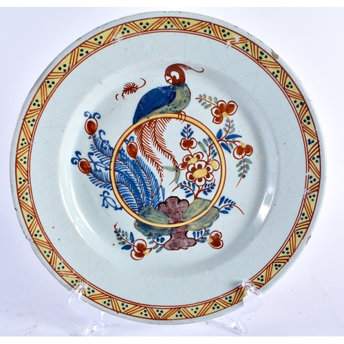 464 - AN 18TH CENTURY DELFT GIN GLAZED POLYCHROMED POTTERY BIRD PLATE together with a similar tin glazed m... 