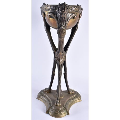 473 - A LARGE MID 19TH CENTURY BRONZE TRI LEGGED TABLE CENTREPIECE formed with Bacchus mask heads, formed ... 