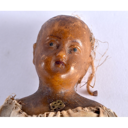 477 - AN EARLY WAX EMBROIDERED DOLL . 18 cm high.