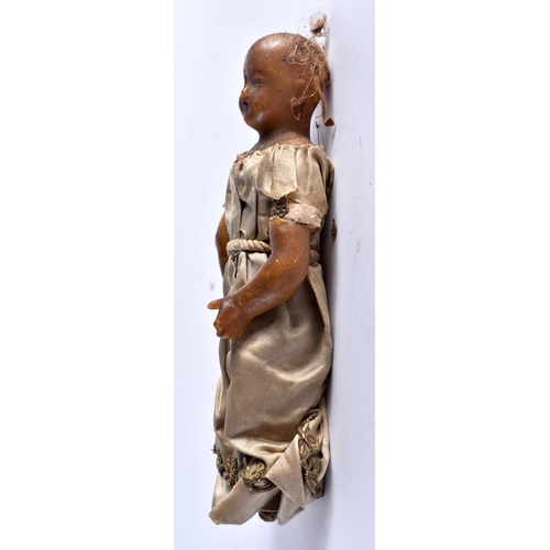 477 - AN EARLY WAX EMBROIDERED DOLL . 18 cm high.