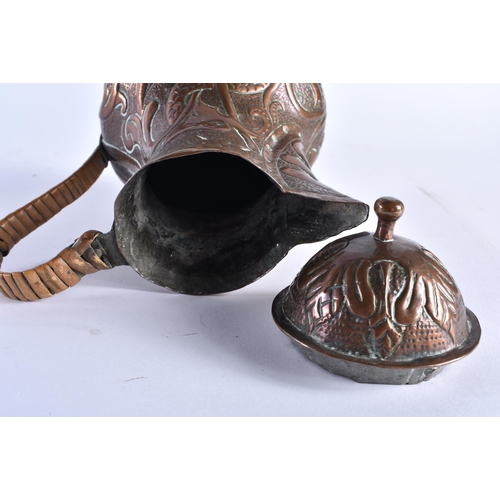 478 - AN ARTS AND CRAFTS REPOUSSE COPPER STYLISED BIRD FLAGON possibly Newlyn. 21 cm x 14 cm.