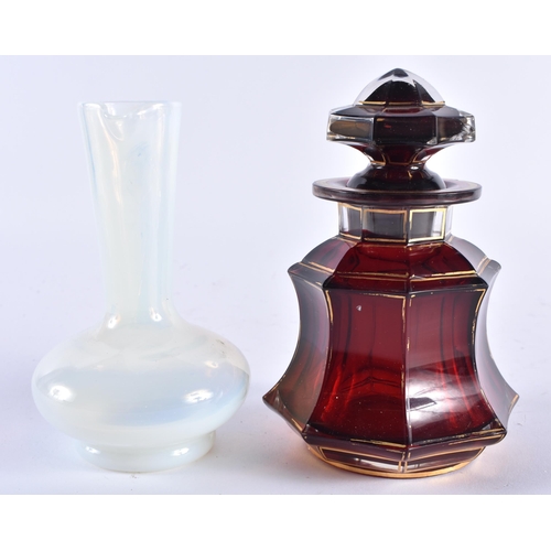 483 - AN ANTIQUE BOHEMIAN GILDED RUBY GLASS SCENT BOTTLE AND STOPPER together with an opaline glass jug. L... 