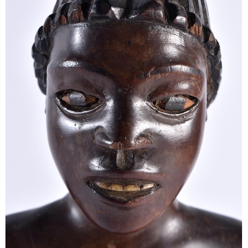 487 - AN AFRICAN TRIBAL CARVED WOOD FIGURE OF A MUSICIAN with painted features. 36 cm high.