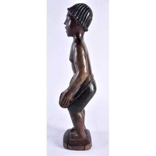 487 - AN AFRICAN TRIBAL CARVED WOOD FIGURE OF A MUSICIAN with painted features. 36 cm high.