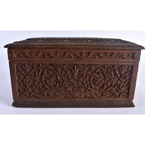 488 - A LARGE 19TH CENTURY ANGLO INDIAN CARVED WOOD COUNTRY HOUSE CASKET decorated with foliage and scroll... 