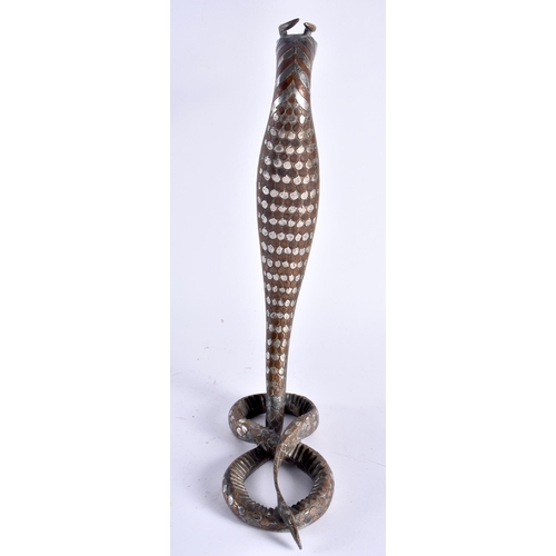 490 - A RARE 19TH CENTURY INDIAN MIDDLE EASTERN SILVER OVERLAID BRONZE COBRA inset with turquoise, decorat... 