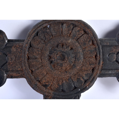 491 - AN ARTS AND CRAFTS CAST SHEET IRON CRUCIFIX formed with floral motifs. 45 cm x 27 cm.