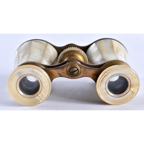 493 - A PAIR OF MOTHER OF PEARL OPERA GLASSES. 9 cm x 8 cm extended.