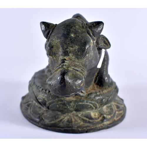 502 - A 19TH CENTURY INDIAN BRONZE FIGURE OF A NANDI BULL modelled recumbent. 18 cm x 12 cm.