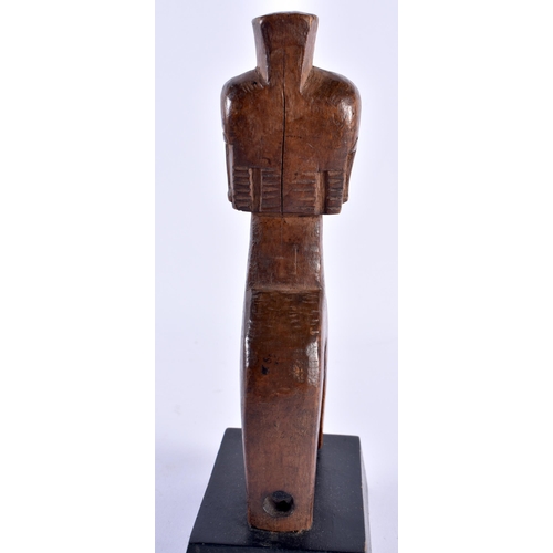 511 - AN AFRICAN TRIBAL CARVED WOOD PULLEY. 22 cm high.