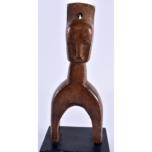 511 - AN AFRICAN TRIBAL CARVED WOOD PULLEY. 22 cm high.