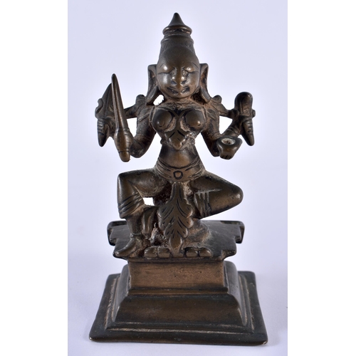 516 - AN 18TH CENTURY INDIAN BRONZE FIGURE OF A BUDDHISTIC DEITY modelled upon a stepped base. 12 cm high.