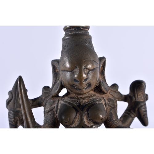 516 - AN 18TH CENTURY INDIAN BRONZE FIGURE OF A BUDDHISTIC DEITY modelled upon a stepped base. 12 cm high.