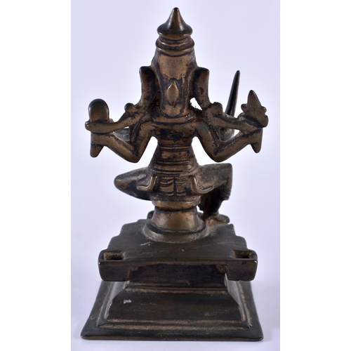 516 - AN 18TH CENTURY INDIAN BRONZE FIGURE OF A BUDDHISTIC DEITY modelled upon a stepped base. 12 cm high.