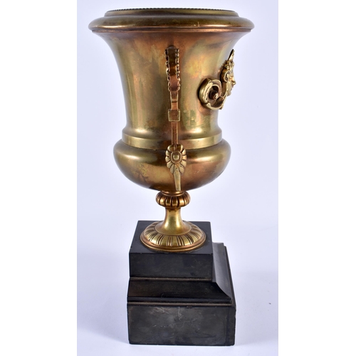 518 - A 19TH CENTURY FRENCH TWIN HANDLED BRONZE VASE upon a slate base. 29 cm high.