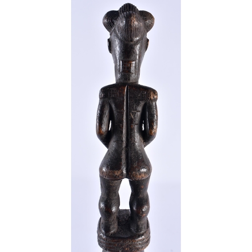 519 - AN AFRICAN TRIBAL CARVED WOOD STAFF. 45 cm long.