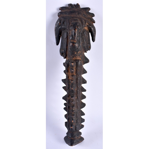 530 - AN EARLY PAPUA NEW GUINEA TRIBAL CARVED WOOD VOTIVE. 25 cm high.