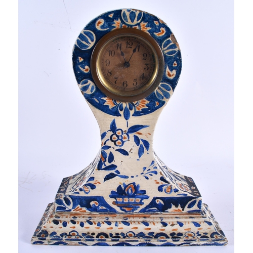 533 - AN ANTIQUE FOLK ART PAINTED WOOD MANTEL CLOCK together with a pair of enamelled clover frames. Large... 