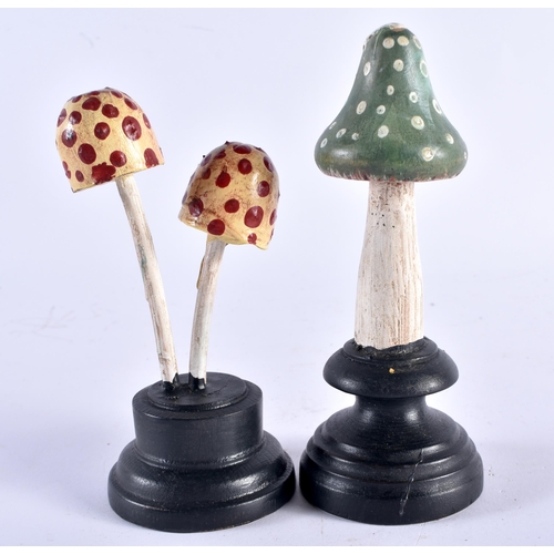 544 - TWO UNUSUAL CARVED FOLK ART PAINTED WOOD MUSHROOM SPECIMANS. 12 cm high. (2)