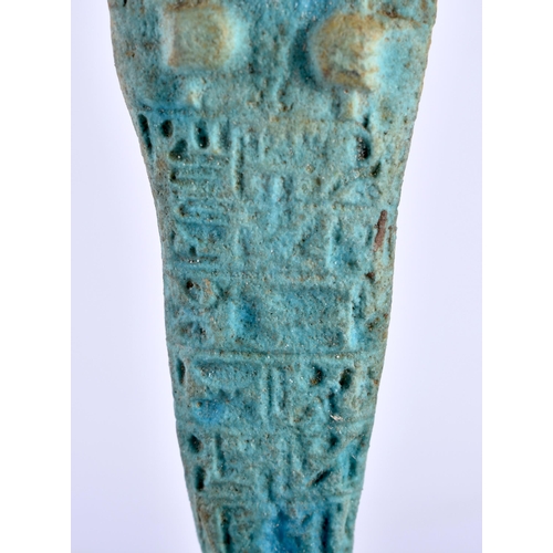 549 - AN EGYPTIAN FAIENCE GLAZED USHABTI FIGURE upon a later ebonised base. Ushabti 11 cm high.